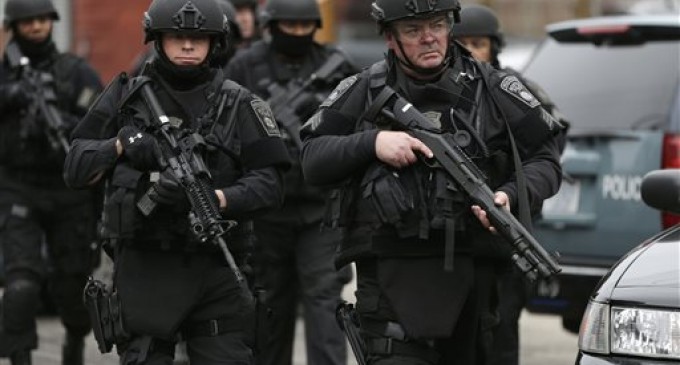 Shots fired in Mass. as police seek bomb suspect
