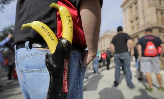 Gun rights activists carry bananas at rally