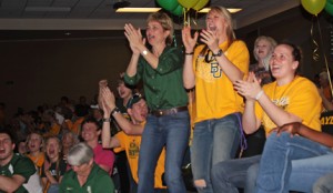 Coach Kim Mulkey and No. 5 guard Melissa Jones stand up to cheer during the NCAA selection show watch party in the Stone Room of the Ferrell Center Monday, Mar 14, 2011. Nick Berryman | Lariat Photographer