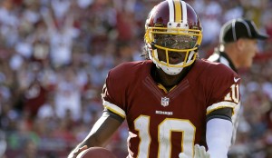 Washington Redskins quarterback Robert Griffin III scores on a five-yard touchdown run against the Tampa Bay Buccaneers during the second quarter of an NFL football game Sunday, Sept. 30, 2012, in Tampa, Fla. (AP Photo/Margaret Bowles)