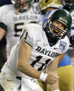 Baylor quarterback Nick Florence celebrates a touchdown during the Holiday Bowl. The Bears won, 49-26. Associated Press