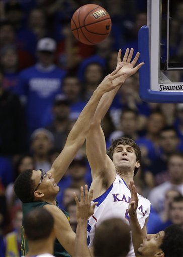 Kansas center Jeff Withey, right, blocks a shot by Baylor center Isaiah Austin, left, during the first half of an NCAA college basketball game in Lawrence, Kan., Monday, Jan. 14, 2013. (Associated Press)