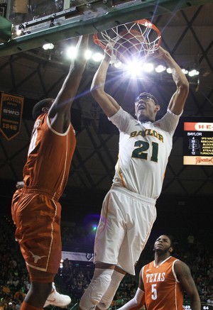 No. 21 forward Isaiah Austin dunks the ball during the second half of the matchup on Saturday, Jan. 5, 2013, in the Ferrell Center. The Bears defeated the Longhorns 86-79 in overtime.Matt Hellman | Lariat Photo Editor