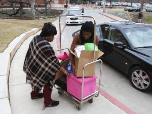 Patience Eguaveon from Mesquite helps here junior daughter Sophia move items into here new room in Brooks Flats Residence Hall on Thursday, Jan. 10, 2013, during Spring move-in. Matt Hellman | Lariat Photo Editor