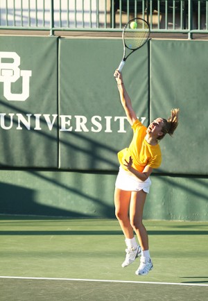 #1 singles player Ema Burgic serves against Sam Houston State at the Hurd Tennis Center on Thursday, Jan. 24, 2013.   Travis Taylor | Lariat Photographer