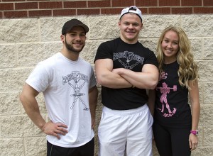 Linden, Mich., junior Alex Barbaretta; Colorado Springs, Colo., senior Eric Press; and Linden, Mich., sophomore Shawna Tharp work with Barbell Fitness to help people achieve their health and fitness goals. Ashley Pereyra | Reporter