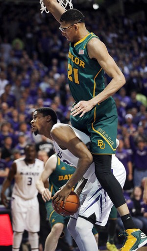 Kansas State forward Jordan Henriquez (21) is fouled by Baylor center Isaiah Austin (21) during the second half of an NCAA college basketball game in Manhattan, Kan., Saturday, Feb. 16, 2013. Kansas State defeated Baylor 81-61. Associated Press