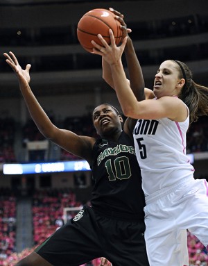 Baylor's Destiny Williams, left, and Connecticut's Caroline Doty, right, fight for control of the ball during the first half of an NCAA college basketball game in Hartford, Conn., Monday, Feb. 18, 2013. Associated Press
