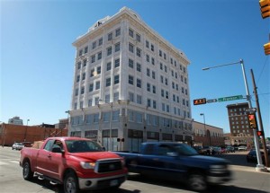 This photo shows the former historic 7-story Praetorian Insurance Company building built in 1915, Thursday, Feb. 21, 2013 in Waco,Texas. For months, work crews and scaffolding have held hostage the historic Praetorian building at South Sixth Street and Franklin Avenue. But now it is breaking the shackles associated with remodeling and living up to the potential that developer Peter Ellis saw in it. Artisans, including Ellis wife, Summer, are staking out space on the Praetorians fourth floor, where Anthem Studios awaits those with creative juices. (AP Photo/ Waco Tribune Herald,Jerry Larson)