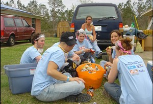 A STORM CORPS crew breaks for lunch in Gulfport, MS., during the 2006 Alternative Spring Break, the first occassion in which MTV partnered with United Way to involve students in disaster relief efforts all over the country.