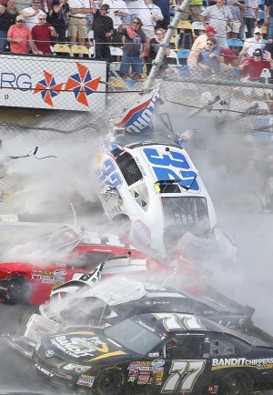 A spectacular crash involving the car of Kyle Larson (32) sends the car into the catch fence and grandstands on the last lap of the DRIVE4COPD 300 Nationwide Series race at Daytona International Speedway in Daytona, Beach, Florida, Saturday, February 23, 2013. (Stephen M. Dowell/Orlando Sentinel/MCT)