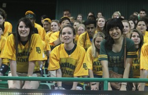 Baylor freshmen assume the whisper position while learning cheers during the Spirit Rally on Friday, Aug. 17, 2012, at the Ferrell Center. Meagan Downing | Round Up Photo Editor