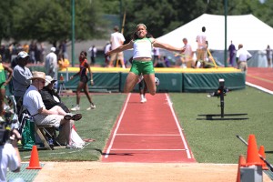 Junior Justine Charbonnet jumps in the long jump. She lived in Louisiana but moved to The Woodlands after being displaced by Hurricane Katrina. Matt Hellman | Lariat Photo Editor