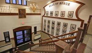 A painting of Jesus Christ, upper left, hangs above an entrance to Jackson Middle School in Jackson, Ohio next to a "Hall of Honor" showing famous Jackson residents and school alumni, on Tuesday. The Jesus portrait has been displayed in the school since 1947. The board voted 4-0 Tuesday night to keep the painting up despite a federal lawsuit that contends the portrait unconstitutionally promotes religion in a public school.  Associated Press