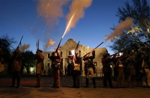 Members of the San Antonio Living History Association fire muskets as they take part in a pre-dawn memorial ceremony to remember the 1836 Battle of the Alamo and those who fell on both sides, Wednesday, March 6, 2013, in San Antonio. (AP Photo/Eric Gay)