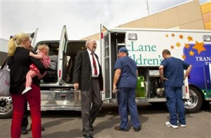 Dr. John L. Boyd III, CEO of McLane Children’s Hospital Scott & White in Temple, steps down from the four-door cab of the hospital’s new custom-built ambulance, while other staff look at its equipment. (Waco Tribune-Herald)