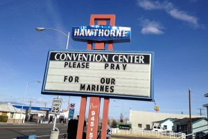 A Convention Center billboard asks people to pray for the Marines that will killed in Hawthorne, Nev. on Tuesday March 19, 2013.  Military officials say a mortar shell explosion killed seven Marines and injured a half-dozen more during a training exercise in Nevada's high desert. The accident prompted the Marine Corps to immediately halt use of some mortar shells until an investigation can determine its safety. (AP Photo/The Reno Gazette-Journal, Marilyn Newton)