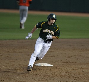 Senior outfielder Nathan Orf rounds second base in Tuesday’s game against Sam Houston State. Baylor lost 4-2 and falls to 9-12 on the year. (Matt Hellman | Lariat Photo Editor)