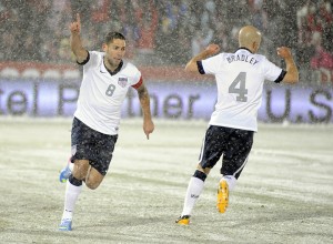 United States forward Clint Dempsey (8) celebrates a goal with Michael Bradley (4) against Costa Rica during the first half of a World Cup qualifier soccer match in Commerce City, Colo., Friday, March 22, 2013. (AP Photo/Jack Dempsey)