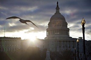 FILE  In this March 7, 2013, file photo the sun breaks through clouds over the U.S. Capitol in Washington.  (AP Photo/J. Scott Applewhite, File)