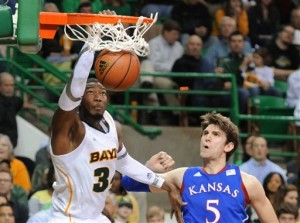 Baylor's Cory Jefferson (34) scores over Kansas Jeff Withey (5) in the second half of an NCAA basketball game on Saturday, March 9,  2013, in Waco, Texas. Baylor won 81-58.  (AP Photo/Waco Tribune Herald, Rod Aydelotte)