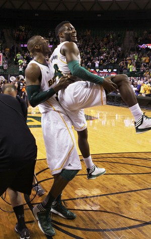 No. 34 forward Cory Jefferson picks up No. 4 guard Gary Franklin after the Bears beat the Friars 79-68 in the Ferrell Center on Wednesday evening advancing them to the semifinals in New York City. Matt Hellman | Lariat Photo Editor