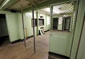 The booking area and two poles where Ernesto Miranda leaned against to be searched 50 years ago today, are shown Wednesday, March 13, 2013 at the Phoenix Police Museum in Phoenix. The arrest of Miranda led to the landmark self-incrimination case that reached the Supreme Court and resulted in Miranda Rights that law enforcement uses when arresting a suspect. (AP Photo/Matt York)