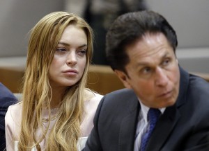 Actress Lindsay Lohan, left, and her attorney Mark Heller appear at a hearing in Los Angeles Superior Court, Monday, March 18, 2013. Lohan accepted a plea deal on Monday in a misdemeanor car crash case that includes 90 days in a rehabilitation facility. The actress, who has struggled for years with legal problems, pleaded no contest to reckless driving, lying to police and obstructing officers who were investigating the accident involving the actress in June. (AP Photo/Reed Saxon, Pool)