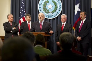 U.S. Department of Health and Human Services (DHHS) Deputy Assistant Secretary, center, speaks during a news conference at the Capitol in Austin, Texas, on Tuesday, March 26, 2013, announcing the approval of an influenza-vaccines manufacturing facility to be located in Bryan-College, Texas. Also shown from left is Texas A&M System Chancellor John Sharp, Gov. Rick Perry, Dr. Brett Giroir, of the Texas A&M System and Antoon Loomans, Senior Vice President of GSK Vaccines.  (AP Photo/Austin American-Statesman, Deborah Cannon)
