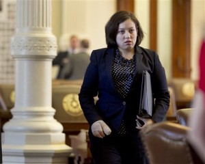 Texas State Rep. Naomi Gonzalez, D-El Paso, who was charged with driving while intoxicated last week after a crash that injured two other people, leaves the House floor after gathering her belongings from her desk on the floor of the chambers at the Capitol in Austin, Texas, on Monday, March 18, 2013. Rep. Gonzalez had earlier addressed the Texas House and apologized for the shame she brought to the chamber and to her district. (AP Photo/Austin American-Statesman, Deborah Cannon)
