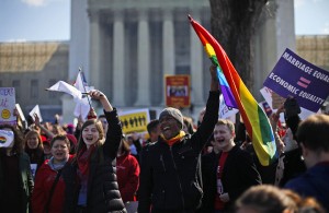 Demonstrators chant outside the Supreme Court in Washington, Tuesday, March 26, 2013, as the court heard arguments on California's voter approved ban on same-sex marriage, Proposition 8. (AP Photo/Pablo Martinez Monsivais)
