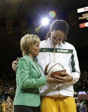 Baylor head coach Kim Mulkey left, hands Brittney Griner, right, a trophy basketball during a pregame ceremony before an NCAA college basketball game against Texas Saturday, Feb. 23, 2013, in Waco, Texas. Griner was honored before the game for becoming the eighth Division I woman with 3,000 career points in Monday's win at No. 3 Connecticut. She moved up to No. 5 on the career list, passing Cindy Blodgett (Maine), Cheryl Miller (Southern California) and Chamique Holdsclaw (Tennessee). She's six points behind UConn's Maya Moore. Baylor defeated Texas 67-47. (AP Photo/Tony Gutierrez)