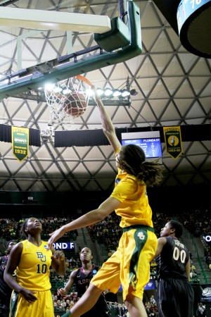 Senior center Brittney Griner dunks the ball against Florida State on Tuesday. She finished with 33 points and 22 rebounds to help the Lady Bears win 85-47. Monica Lake | Lariat Photographer
