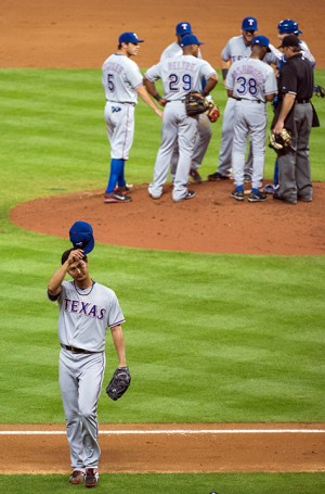Texas Rangers starting pitcher Yu Darvish tips his cap to the crowd as he leaves the game after surrendering a hit in the bottom of the ninth inning against the Houston Astros at Minute Maid Park on Tuesday, April 2, 2013, in Houston. Darvish pitched nine and two-thirds perfect innings before giving up a hit to Astros' Marwin Gonzalez in the Rangers' 7-0 win. (AP Photo/Houston Chronicle, Smiley N. Pool)