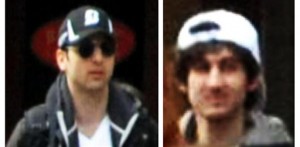 This combo of photos released by the FBI early Friday April 19, 2013, shows what the FBI is calling suspects number 1, left, and suspect number 2, right,  walking through the crowd in Boston on Monday, April 15, 2013, before the explosions at the Boston Marathon. (AP Photo/FBI)
