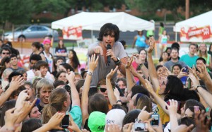 Parachute lead singer Will Anderson is carried through the crowd of Baylor fans by a member of the Baylor Chamber during Diadeloso 2012 at Fountain Mall on Thursday, Apr. 19. Matt Hellman | Lariat Photo Editor