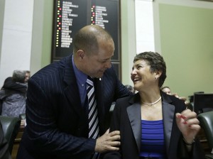 Rhode Island state Sen. Juan Pichardo, D-Providence, congratulates R.I. state Sen. Donna Nesselbush, D-Pawtucket, right,  moments after the R.I. Senate passed a same-sex marriage bill at the Statehouse, in Providence, R.I., Wednesday, April 24, 2013. Nesselbush was the main sponsor of the bill in the Senate. (AP Photo/Steven Senne)