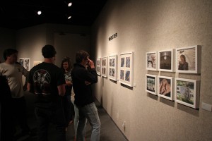 Students view artwork at the Senior Bachelor of Fine Arts Exhibition opening reception Tuesday at the Martin Museum of Art. The students’ senior portfolios will be featured at the Martin Museum through Sunday. (Matt Hellman | Lariat Photo Editor)