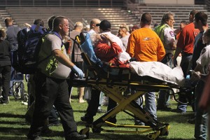 Emergency medical teams and volunteers tend to the wounds and assistance of West residents that lived in houses within the vicinity of the initial explosion at the West Football field on Wednesday, April 17, 2013.  Matt Hellman | Lariat Photo Editor