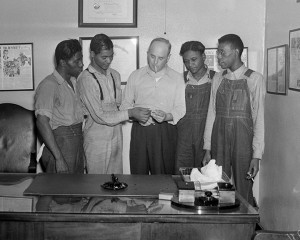 FILE - In this July 26, 1937 file photo, New York attorney Samuel Leibowitz, center, stands in his office in New York with four of the "Scottsboro Boys," from left, Willie Robertson, Eugene Williams, Roy Wright, and Olen Montgomery. Levin is credited with saving from death all but one of the nine black teens who were wrongly convicted of raping two white women in 1931. In a final chapter to one of the most important civil rights episodes in American history, Alabama lawmakers voted Thursday, April 4, 2013 to give posthumous pardons to the "Scottsboro Boys". (AP Photo, File)