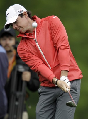 Rory McIlroy, of Northern Ireland, chips to the ninth green during the first round of the Wells Fargo Championship golf tournament at Quail Hollow Club in Charlotte, N.C., Thursday, May 2, 2013. (AP Photo/Bob Leverone)