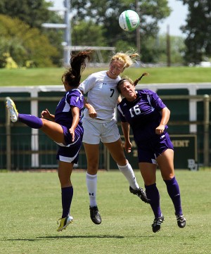 #7 midfielder Alexa Wilde goes up for a header during a game against Northwestern State University. The Lady Bears soccer team defeated Northwestern State 5-0 at the Betty Lou Mays Soccer Field on Sunday, August 25, 2013.  Travis Taylor | Lariat Photo Editor