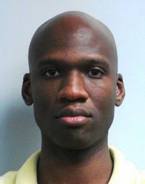 This image released by the FBI shows a photo of Aaron Alexis, who police believe was a gunman at the Washington Navy Yard shooting in Washington, Monday morning, Sept. 16, 2013, and who was killed after he fired on a police officer. At least one gunman launched an attack inside the Washington Navy Yard, spraying gunfire on office workers in the cafeteria and in the hallways at the heavily secured military installation in the heart of the nation's capital, authorities said. (AP Photo/FBI)