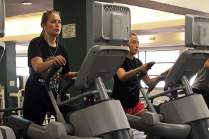 Denver, Colo. freshman Annalise Pequette (left) and Estancia, N.M. freshman Mikayla Calhoon work out on the new elliptical trainers at the Student Life Center on Wednesday, August 28, 2013.   Travis Taylor | Lariat Photo Editor