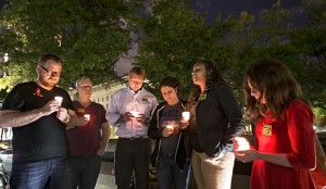 A small group holds a candle light vigil on Freedom Plaza to remember the victims of the shooting at the Washington Navy Yard, Monday, Sept. 16, 2013, in Washington.  (AP Photo/J. Scott Applewhite)