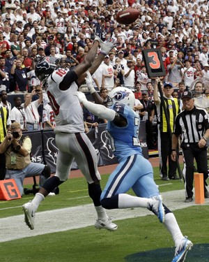 Houston Texans' DeAndre Hopkins (10) catches the winning touchdown over Tennessee Titans' Jason McCourty, right, during overtime of an NFL football game on Sunday, Sept. 15, 2013, in Houston. (AP Photo/David J. Phillip)