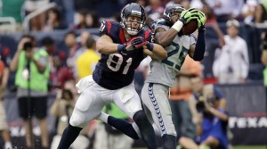 Seattle Seahawks' Richard Sherman (25) intercepts the ball in front of Houston Texans' Owen Daniels (81) during the fourth quarter an NFL football game on Sunday, Sept. 29, 2013, in Houston. Sherman returned the ball for a touchdown. (AP Photo/Patric Schneider)