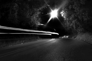 Cars drive by Lindsey Hollow Road late at night. Lindsey Hollow Road is considered by some to be haunted. Waco is home to several ghost stories and rumors. Robby Hirst | Lariat Photographer