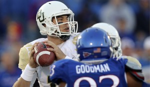 Baylor Bears quarterback Bryce Petty, left, looks to pass in the first quarter of an NCAA college football game against the Kansas Jayhawks, Saturday, Oct. 26, 2013, in Lawrence, Kan. (AP Photo/Ed Zurga)
