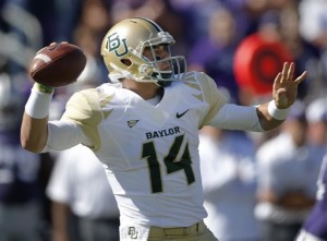 Baylor quarterback Bryce Petty (14) passes to a teammate during the first half of an NCAA college football game against Kansas State in Manhattan, Kan., Saturday, Oct. 12, 2013. (AP Photo/Orlin Wagner)